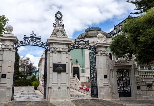 Main gate of the 5 star hotel occupying the sumptuous neoclassical Vale Flor Palace built in early 20th century in Lisbon, Portugal