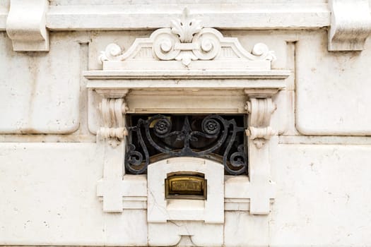 Detail of the brass letterbox of the sumptuous neoclassical Vale Flor Palace built in early 20th century in Lisbon, Portugal.Trans: Letters.