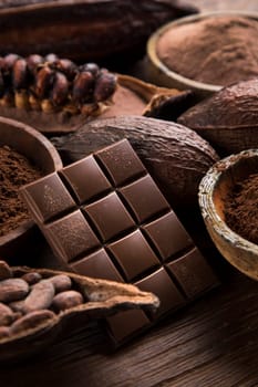 Aromatic cocoa and chocolate on natural paper background