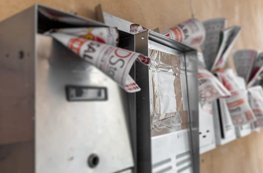 Advertising in the olded mailboxes. Spam concept.