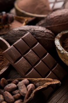 Milk and dark chocolate on a natural paper background
