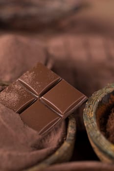 Aromatic cocoa and chocolate on natural paper background