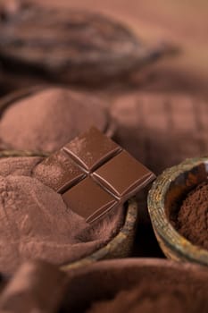 Milk and dark chocolate on a natural paper background