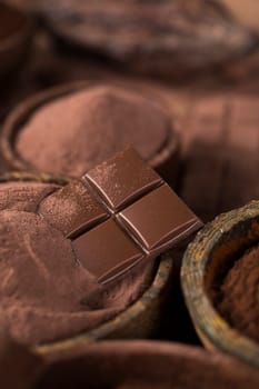 Milk and dark chocolate on a natural paper background