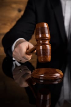 Justice and law concept, Male judge in a courtroom striking the gavel