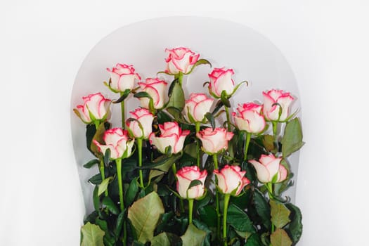 Pink roses flowers in a bath with water.