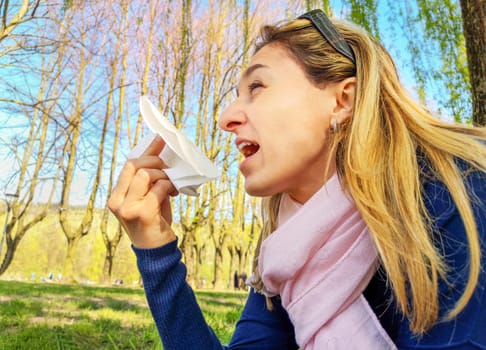 sneeze allergic hay fever pollen allergy blowing nose springtime .