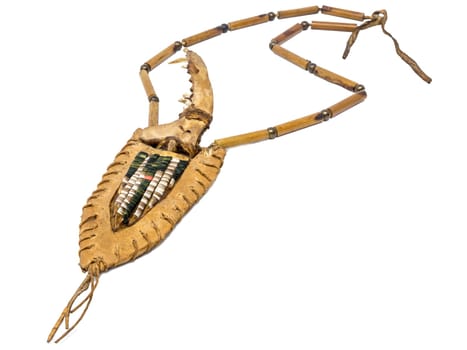 Indian bone knife with a handle made of fox bones in a quiver of rawhide decorated with porcupine bristles