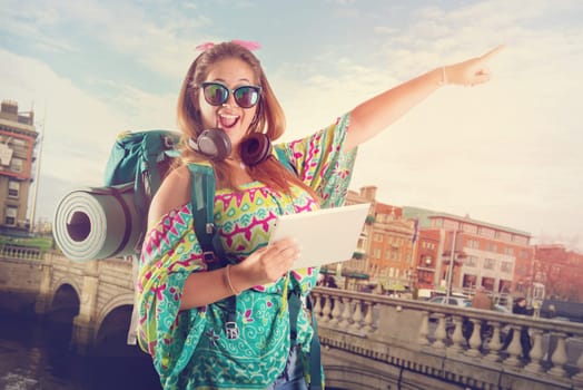 Hiker girl with tablet isolated in white, trekking and travel lifestyle concept