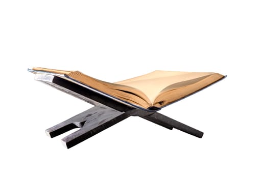 Quran open on wooden placemat isolated over white background