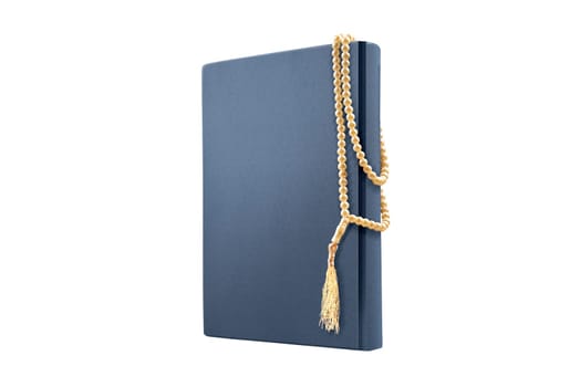 Quran and prayer beads isolated over white background