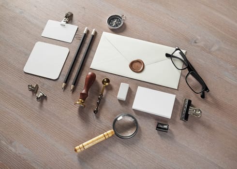 Blank envelope and retro stationery template on wooden background. Mock up for branding identity.