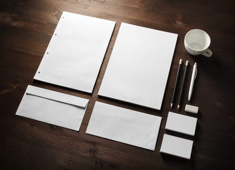 Blank corporate stationery set on wooden background. Branding mock up.