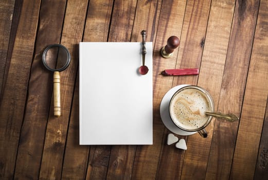 Photo of blank vintage stationery set on wooden background. Responsive design template. Flat lay.