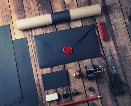 Blank black retro stationery template on wooden background.