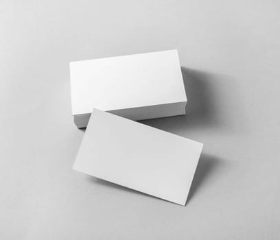 Photo of blank business cards on paper background. Template for ID.