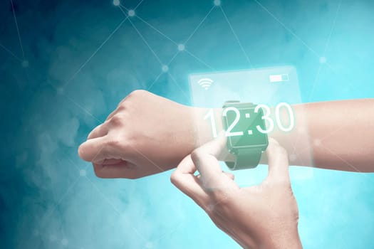 Male hand with smartwatch check the time. Digital technology concept