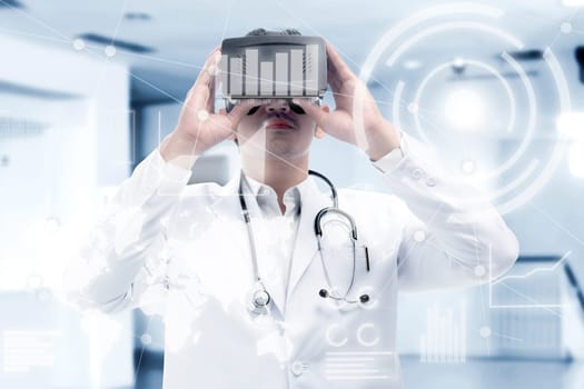 Asian male doctor in white coat and stethoscope looking at digital interface with virtual reality device display the world map, graphic bar and binary code. Augmented reality technology