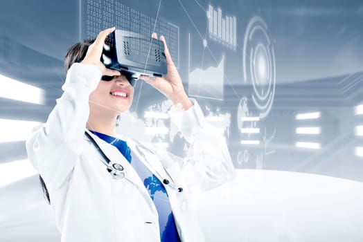 Asian female doctor in white coat and stethoscope looking at digital interface with virtual reality device display the world map, graphic bar and binary code. Augmented reality technology