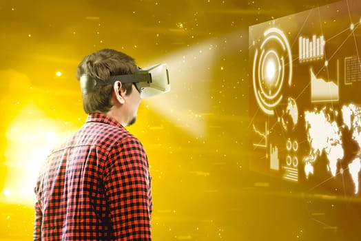 Rear view of asian man looking at digital interface with virtual reality device display the world map, graphic bar and binary code. Augmented reality technology