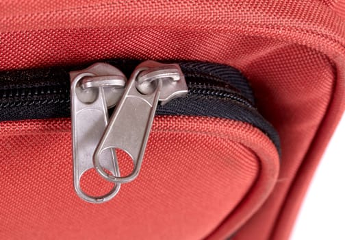 Suitcase zipper, selective focus - Old red bag