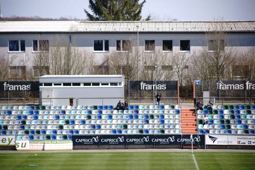 Pirmasens, Germany - March 30, 2019: The modern and colorful seats of a tribune of the sports park Husterhoehe of the soccer club FK Pirmasens on March 30, 2019 in Pirmasens..