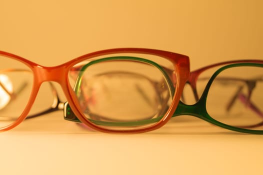 Rimmed eyeglasses closeup on a white background abstract view