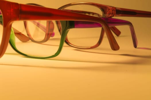 Rimmed eyeglasses closeup on a white background abstract view