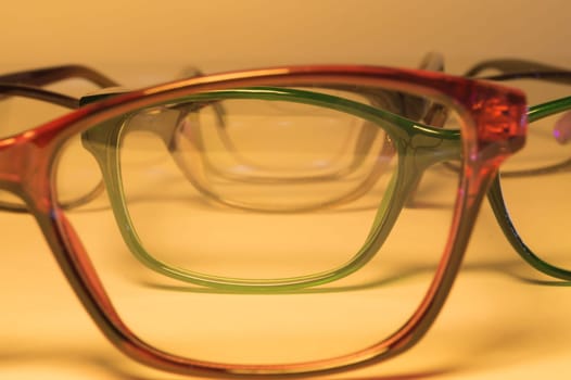 Rimmed eyeglasses closeup on a white background abstract view