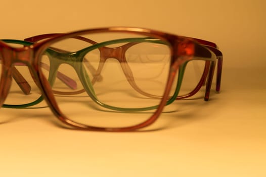 Rimmed eyeglasses closeup on a white background abstract view
