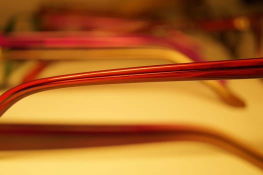Rimmed eyeglasses closeup on a white background abstract view