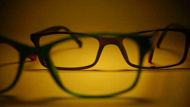 Rimmed eyeglasses closeup on a white background abstract view