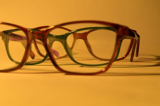 Rimmed eyeglasses closeup on a white background abstract view
