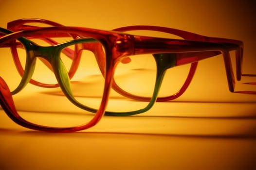 Rimmed eyeglasses closeup on a white background abstract view