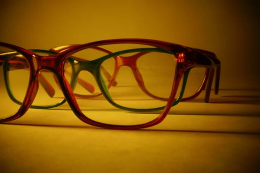 Rimmed eyeglasses closeup on a white background abstract view