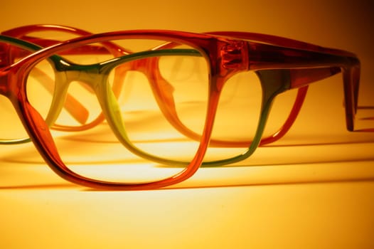 Rimmed eyeglasses closeup on a white background abstract view