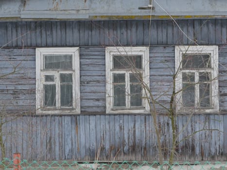 windows of an aged wooden farmhouse