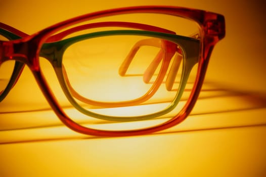 Rimmed eyeglasses closeup on a white background abstract view