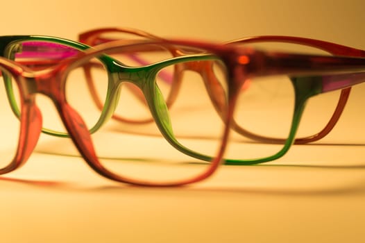 Rimmed eyeglasses closeup on a white background abstract view