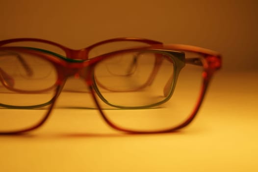 Rimmed eyeglasses closeup on a white background abstract view