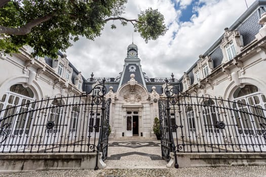 Facade of the horse stables in the same romantic style as the main Vale Flor Palace across the road, in Alcantara, Lisbon, Portugal