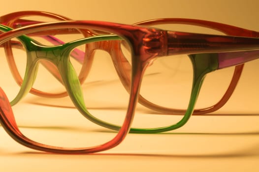 Rimmed eyeglasses closeup on a white background abstract view