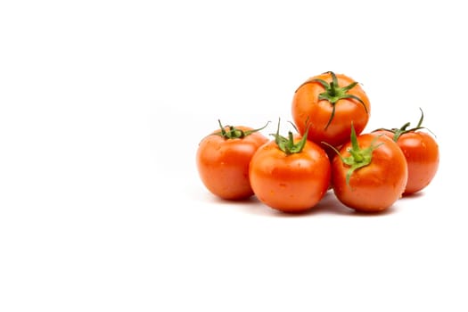 Tomato closeup on white background. Selective focus and crop fragment