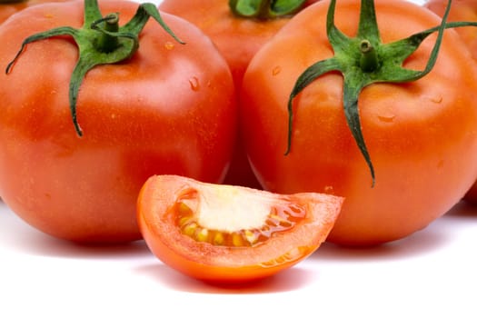 Tomato closeup on white background. Selective focus and crop fragment