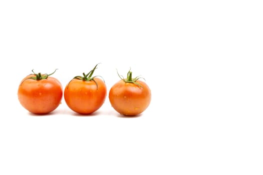 Tomato closeup on white background. Selective focus and crop fragment