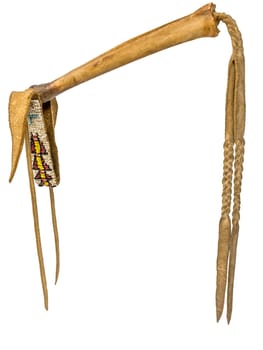 Coup-Stick of the Native American Indian of buffalo bone and leather isolated on white