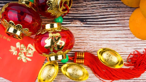 Kuala Lumpur, Malaysia- September 12, 2017:  Mandarin Orange, Red Envelopes, lantern land Gold Ingots. New Year background concept