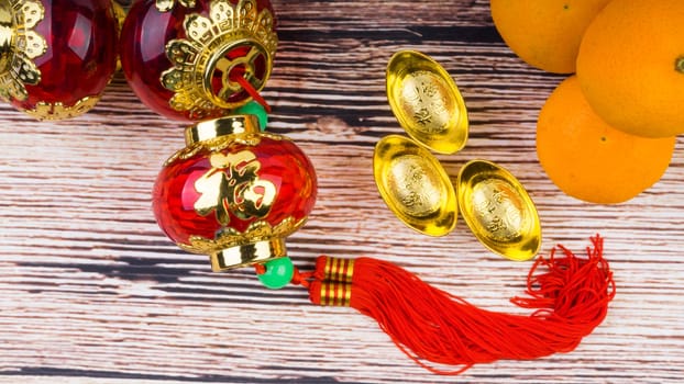 Kuala Lumpur, Malaysia- September 12, 2017:  Mandarin Orange, Red Envelopes, lantern land Gold Ingots. New Year background concept