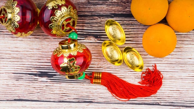 Kuala Lumpur, Malaysia- September 12, 2017:  Mandarin Orange, Red Envelopes, lantern land Gold Ingots. New Year background concept