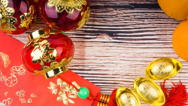 Kuala Lumpur, Malaysia- September 12, 2017:  Mandarin Orange, Red Envelopes, lantern land Gold Ingots. New Year background concept